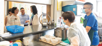 Professor Chan (first left) visited Phoenix Clubhouse and its clinic jointly operated by the David Trench Rehabilitation Centre and the Hospital Authority.