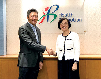 Professor Chan (right) exchanged views with the Chief Executive Officer of the Health Promotion Board of Singapore, Mr Zee Yoong-kang, on strategies to prevent and control non-communicable seases in November 2018.