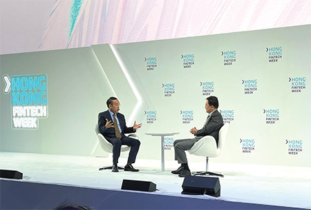 Mr Hui (left), joining the Founder and Chief Executive Officer of Hillhouse Group, Mr Zhang Lei, for a fireside chat on the future development of Hong Kong's fintech ecosystem on 3 November during the Hong Kong FinTech Week 2021.