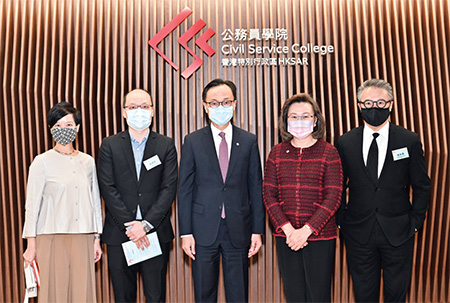 The Director of Architectural Services, Ms Winnie Ho (first left); the Gold Award winner of the Civil Service College Logo Design Competition, Mr Wong Shiu-tao (second left); the Secretary for the Civil Service, Mr Patrick Nip Tak-kuen (centre); the Permanent Secretary for the Civil Service, Mrs Ingrid Yeung Ho Pui-yan (second right); and judging panel member of the Civil Service College Logo Design Competition, Professor Eric Yim (first right).