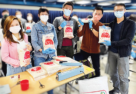 Leadership Essentials Programme participants helped repack rice at food bank for distribution to those in need.