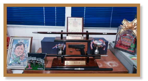 Mr Yu has displayed the police souvenirs collected over the years at the barbershop of the Tsuen Wan Police Station.